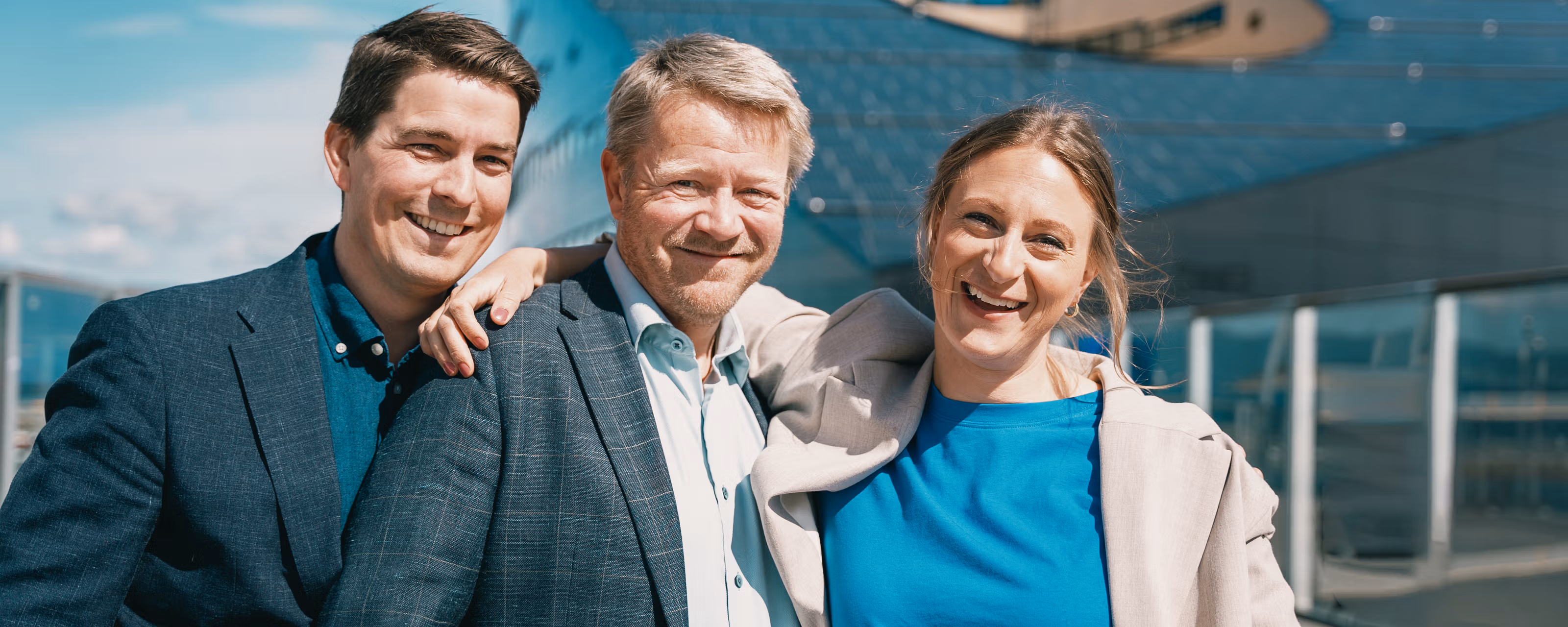 Blide ansatte i Enova sitter i møte på kontoret vårt